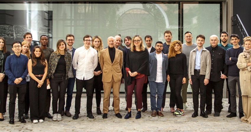 The architect, at the entrance of the Norman Foster Foundation, together with a group of students and collaborators during the third edition of Robotics Atelier (2019)
