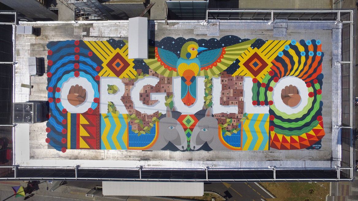 Cali’s Comuna 20 bids welcome. Painted by Boa Mistura on the rooftop of the health centre, it says ORGULLO (pride) and can be seen only from the side of the Metrocable, which goes up to Commune 20 or from the top of the hill.