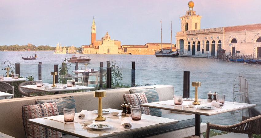 Views of Gio’s Restaurant against the backdrop of the canal at ST. Regis Venice